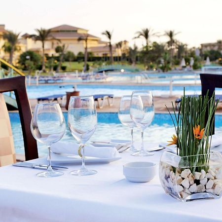 Moevenpick Hotel Cairo - Media City Giza Εξωτερικό φωτογραφία The pool at the resort